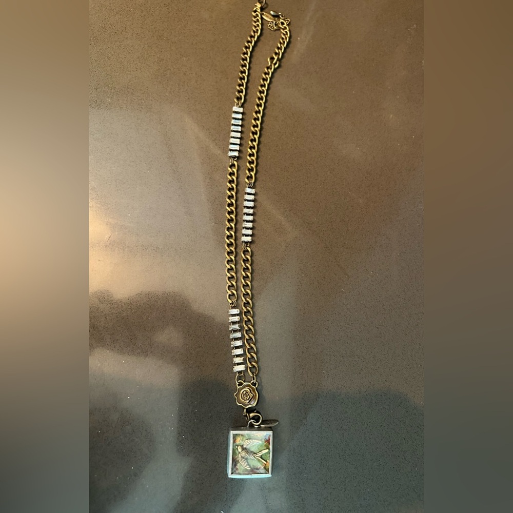 Jewel Kade birds have wings charm on crystal necklace.    Ultra Rare.